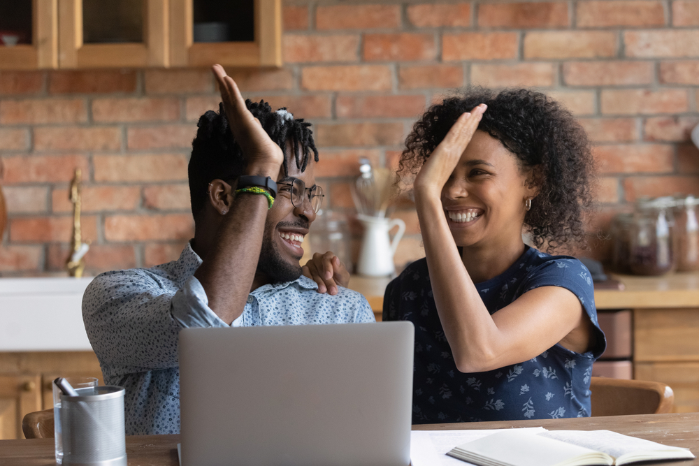 Budget: the people high fiving by the computer